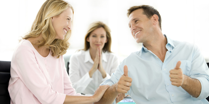 Couple dealing with a financial adviser at the credit union