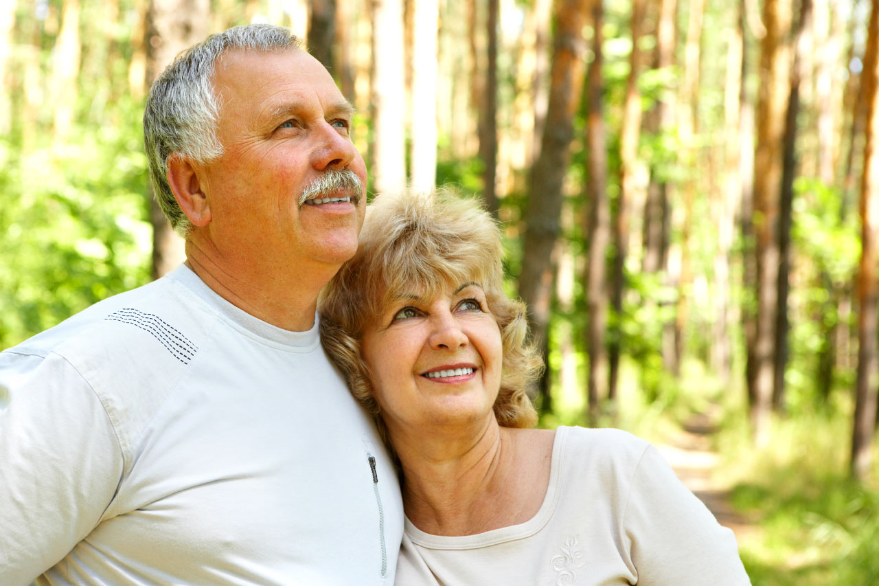 Smiling happy elderly couple in love outdoor