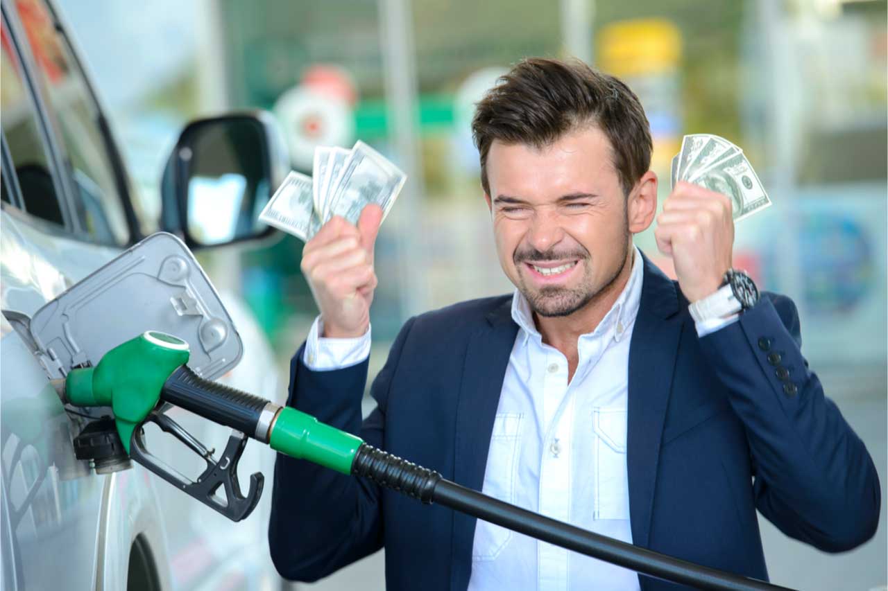 Frustrated man pumping gas